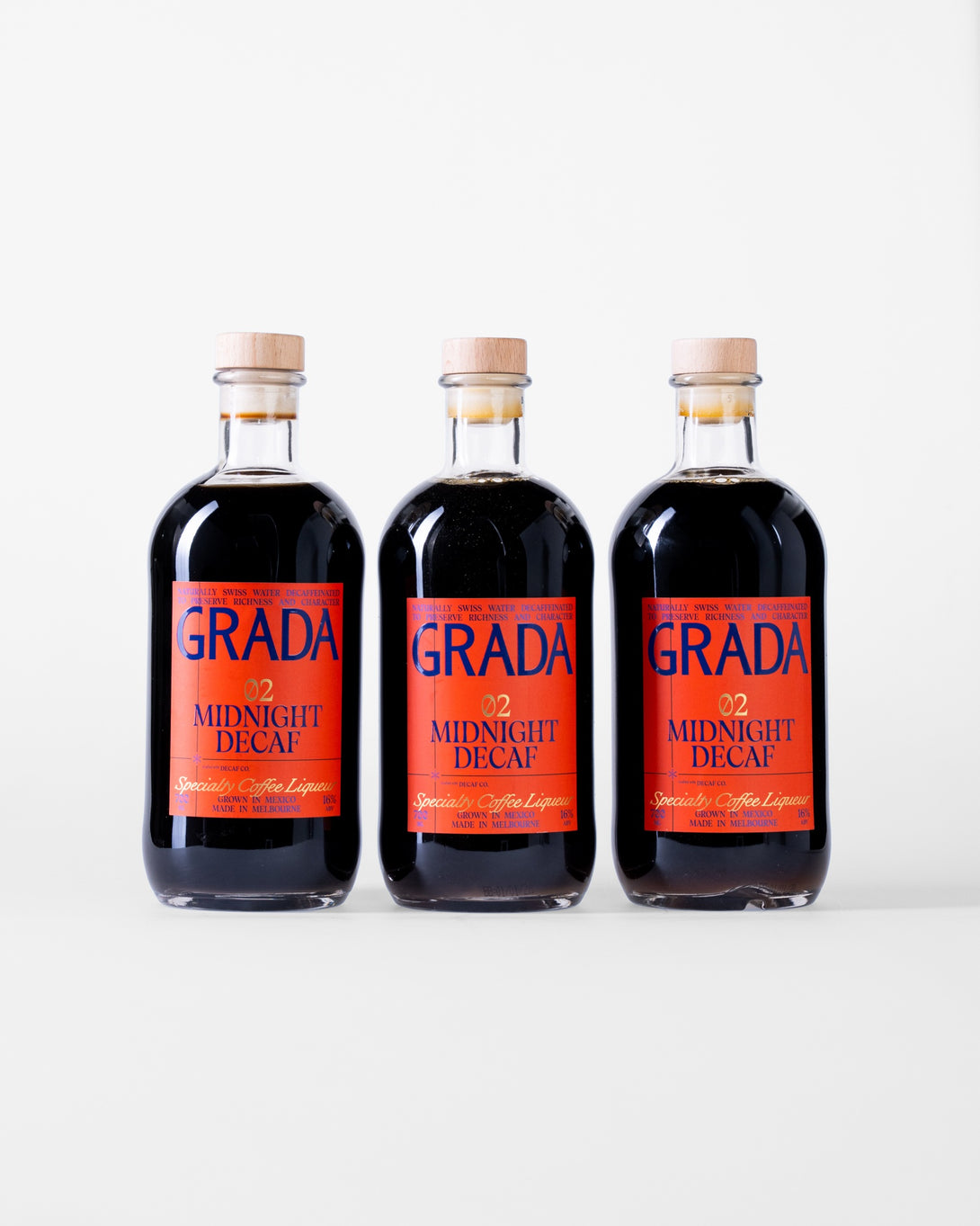 Three bottles of GRADA 02 Midnight Decaf