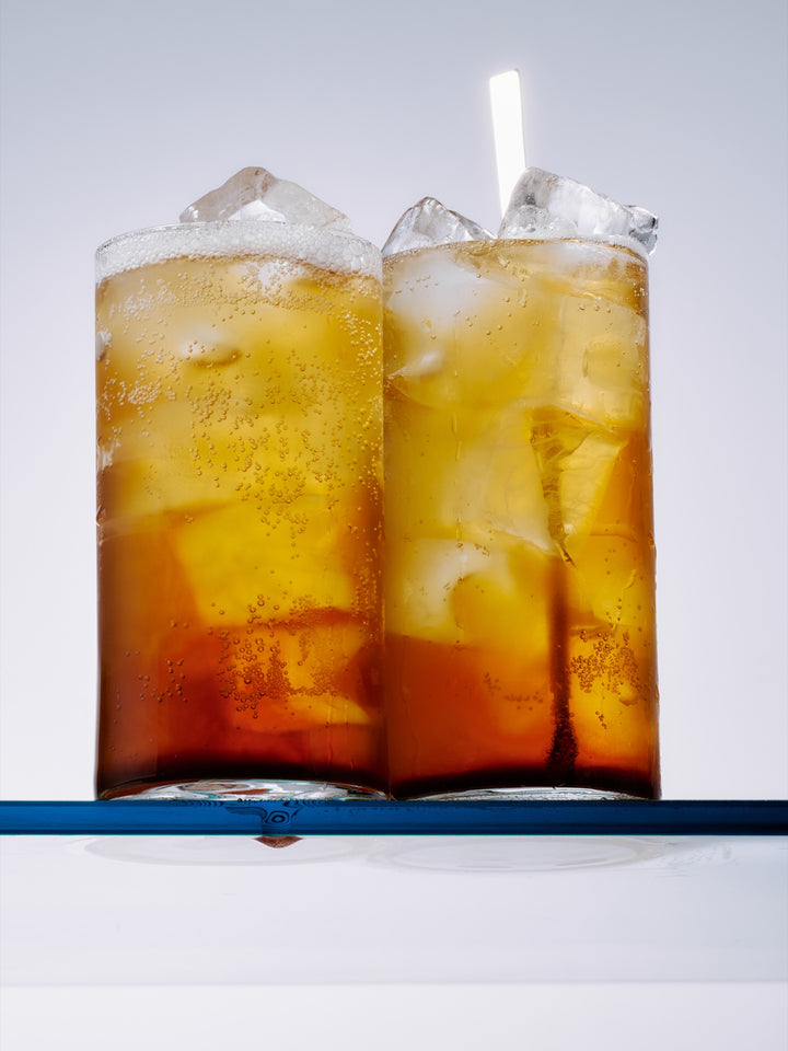 GRADA and Indian tonic built over ice in a highball with a wedge of lime