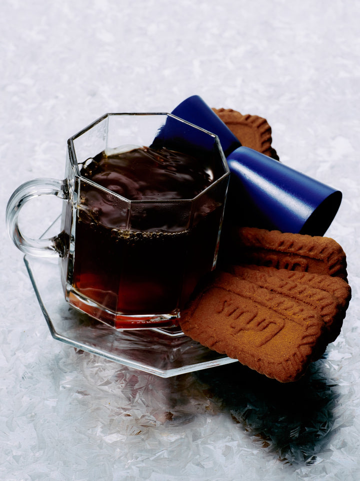 GRADA Night Shift served hot in a glass coffee cup with a Biscoff biscuit