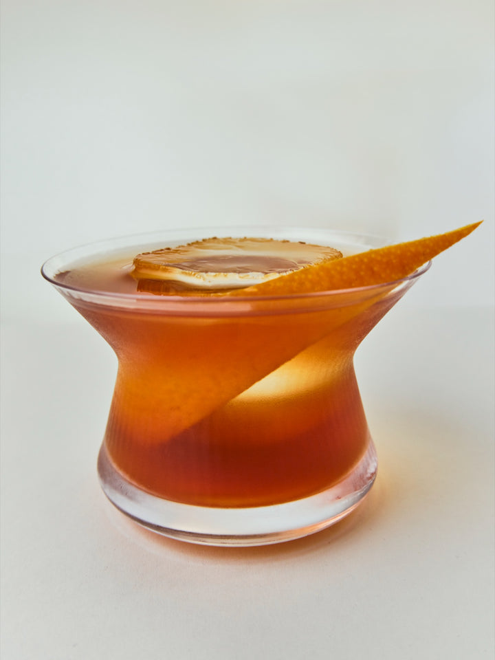 A GRADA Negroni stirred over ice with an orange twist